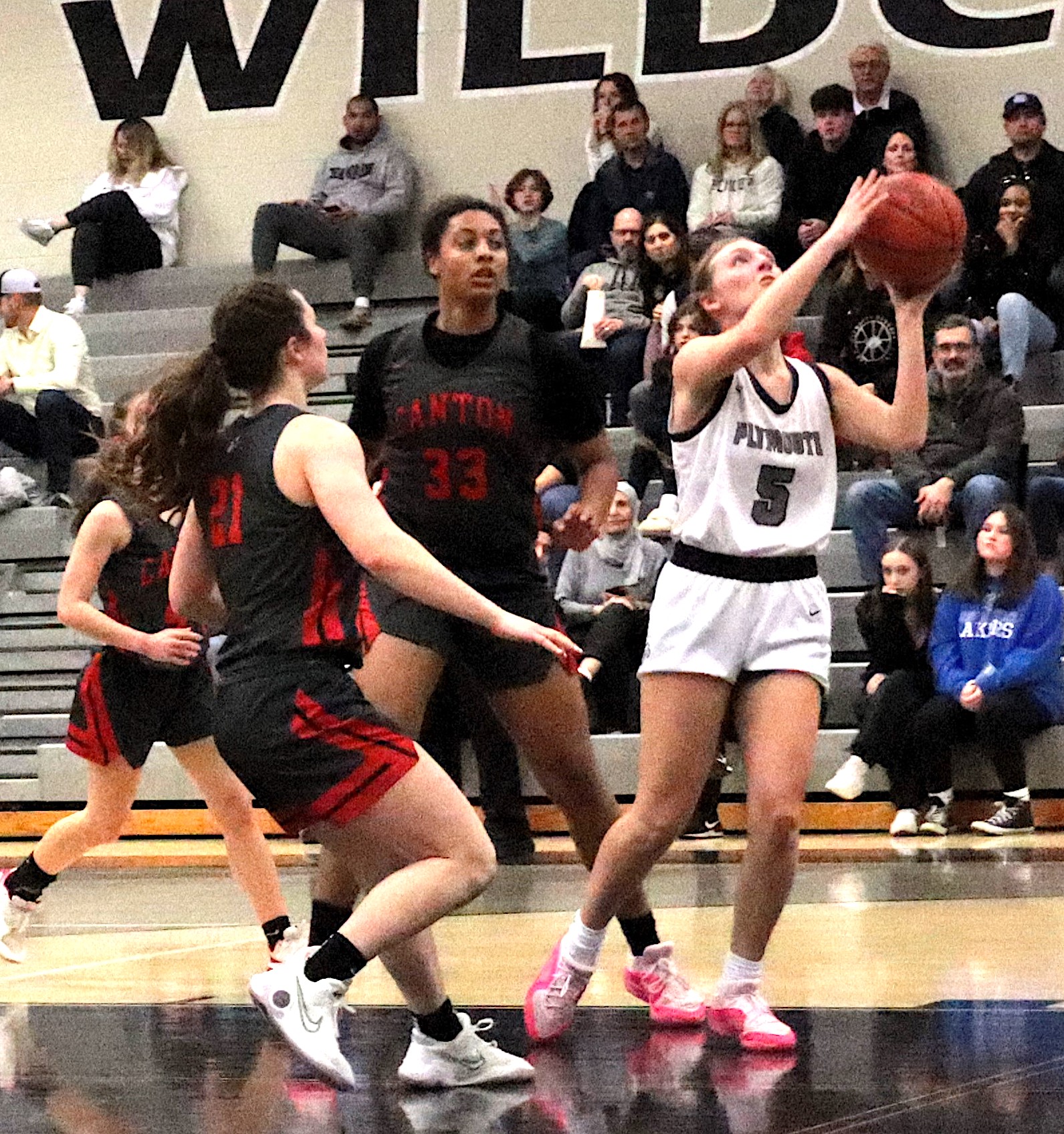 Evelyn Stiglish eyes the basket Friday night against visiting Canton