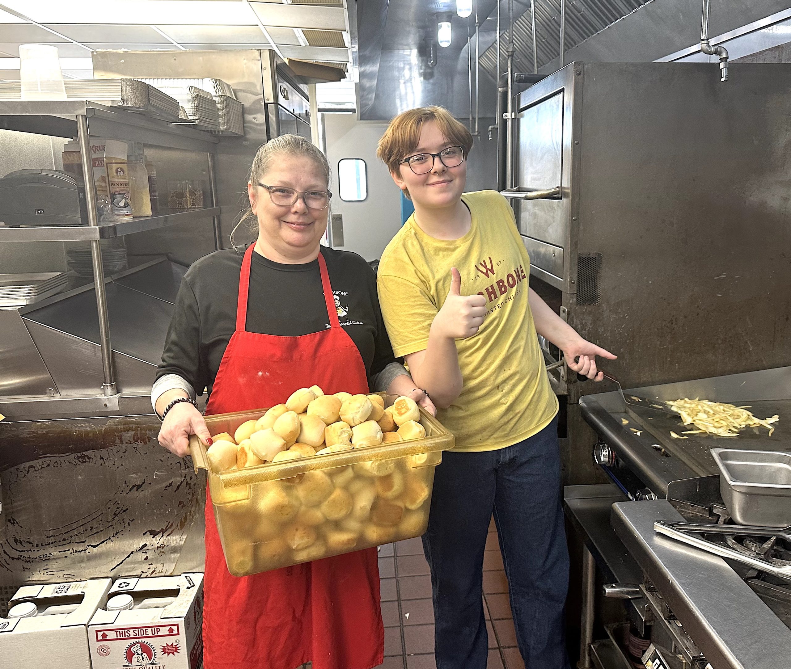 Pictured are Wishbone staff members Karen Johnson and McKenzie Tarrow preparing food on a recent Tuesday afternoon