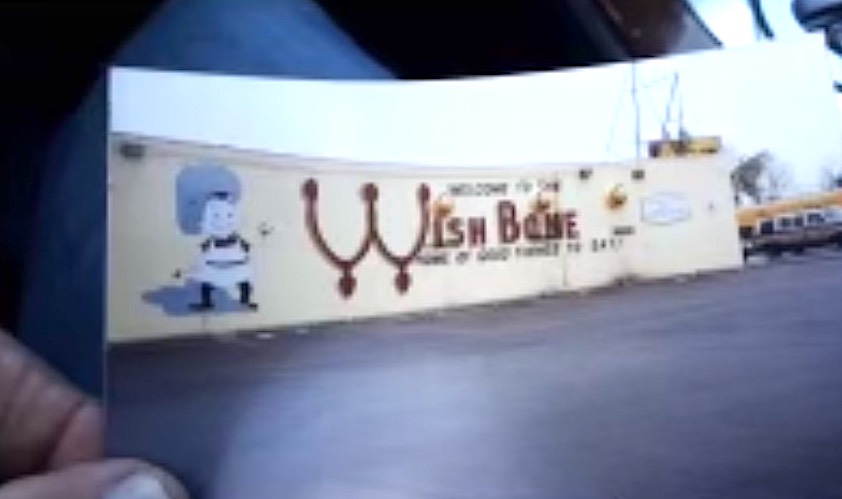 A grainy photo of the original sign painted on the east side of Wishbone