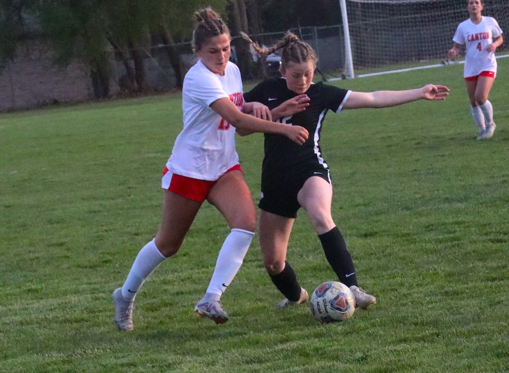 Canton and Plymouth players struggle for possession during Tuesday night's 2-2 draw.