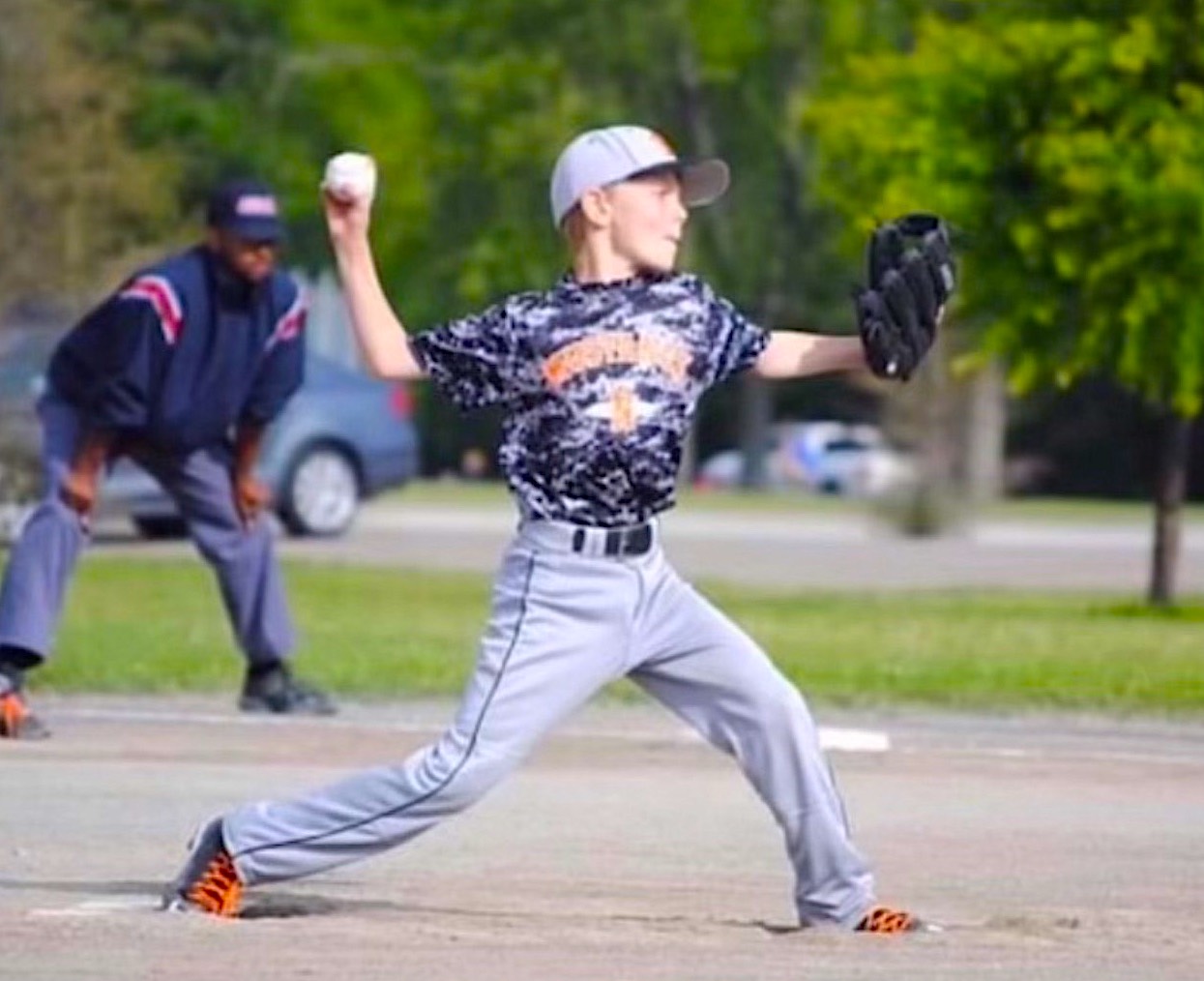 A younger Justin Brown is pictured pitching for a Northville youth travel team