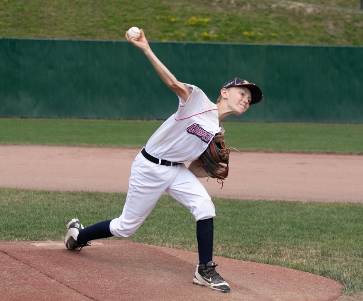 A pre-high school Justin Brown delivers a pitch