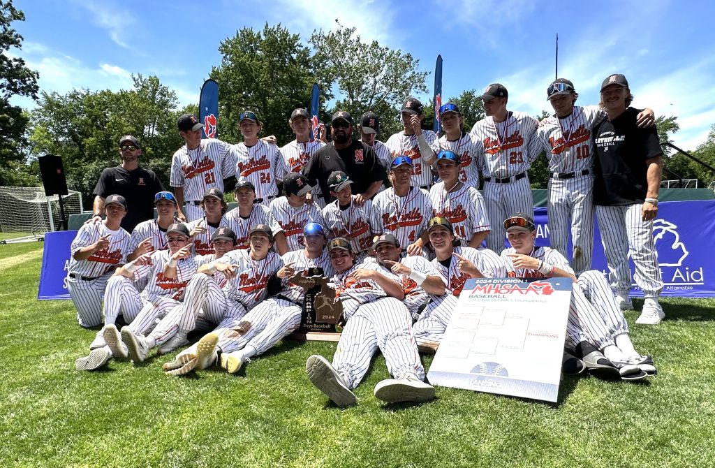 Members of Northville's state-championship baseball team pose for a photo after receiving their hardware.