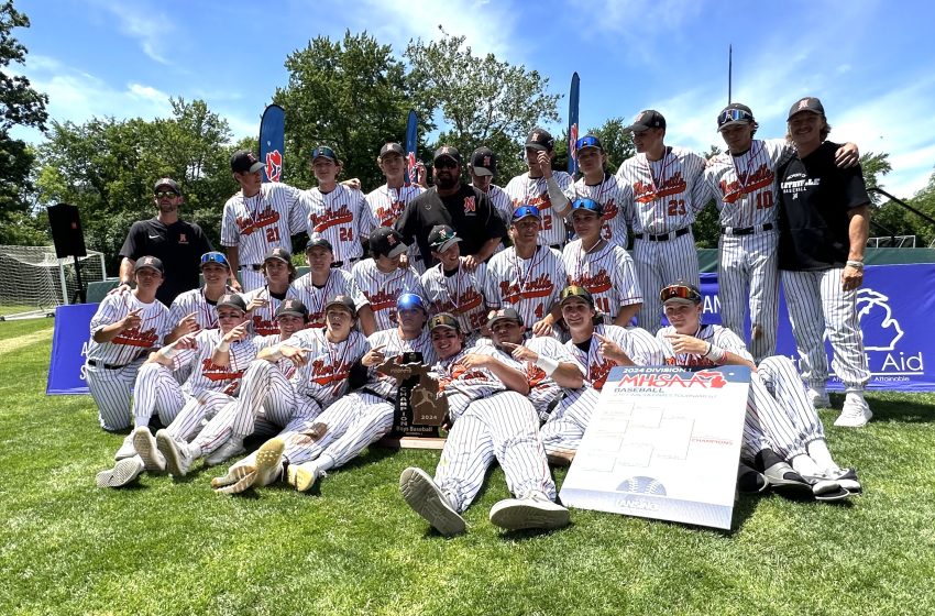 Members of Northville's state-championship baseball team pose for a photo after receiving their hardware.