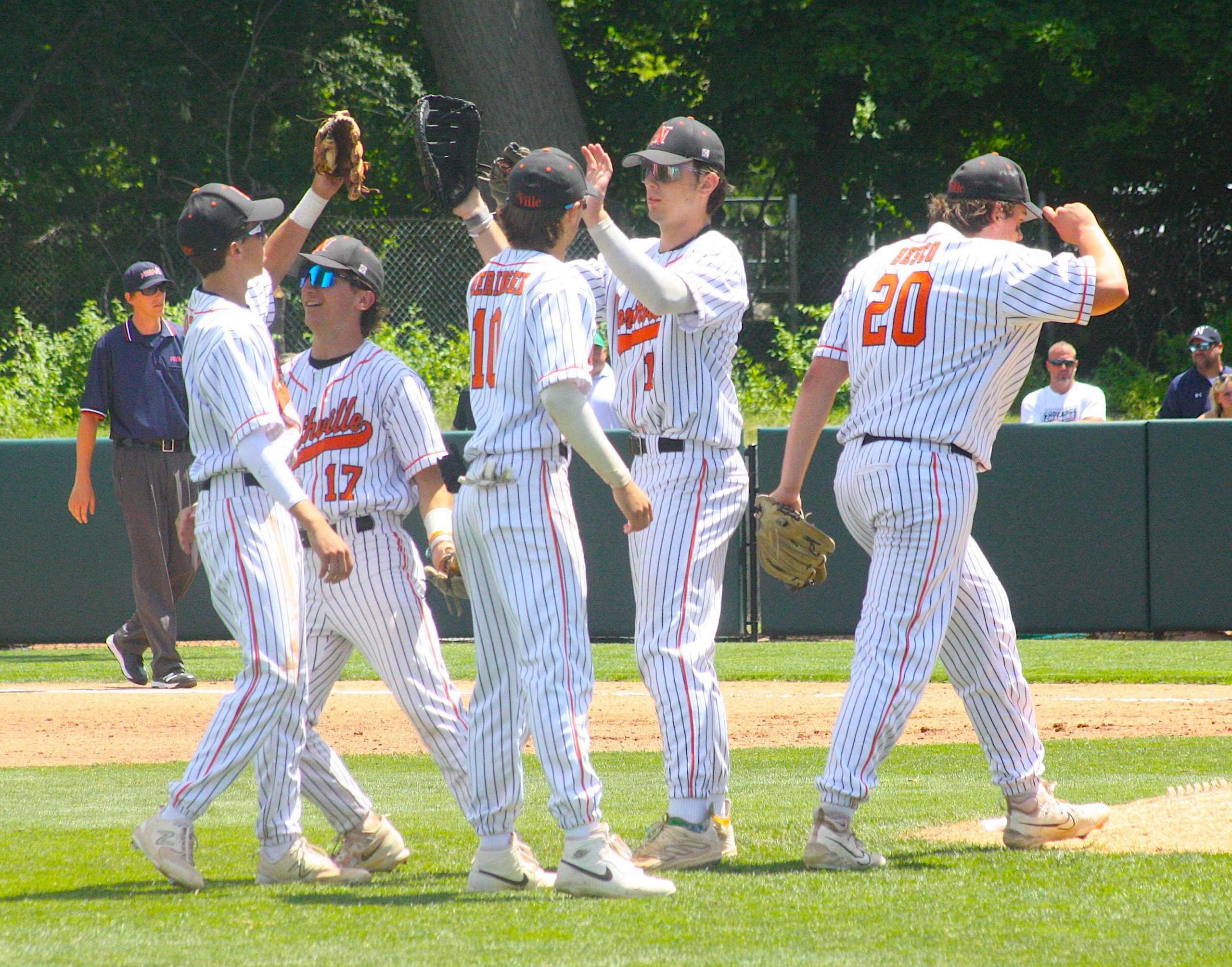 Northville infielders converge before the start of the seventh inning