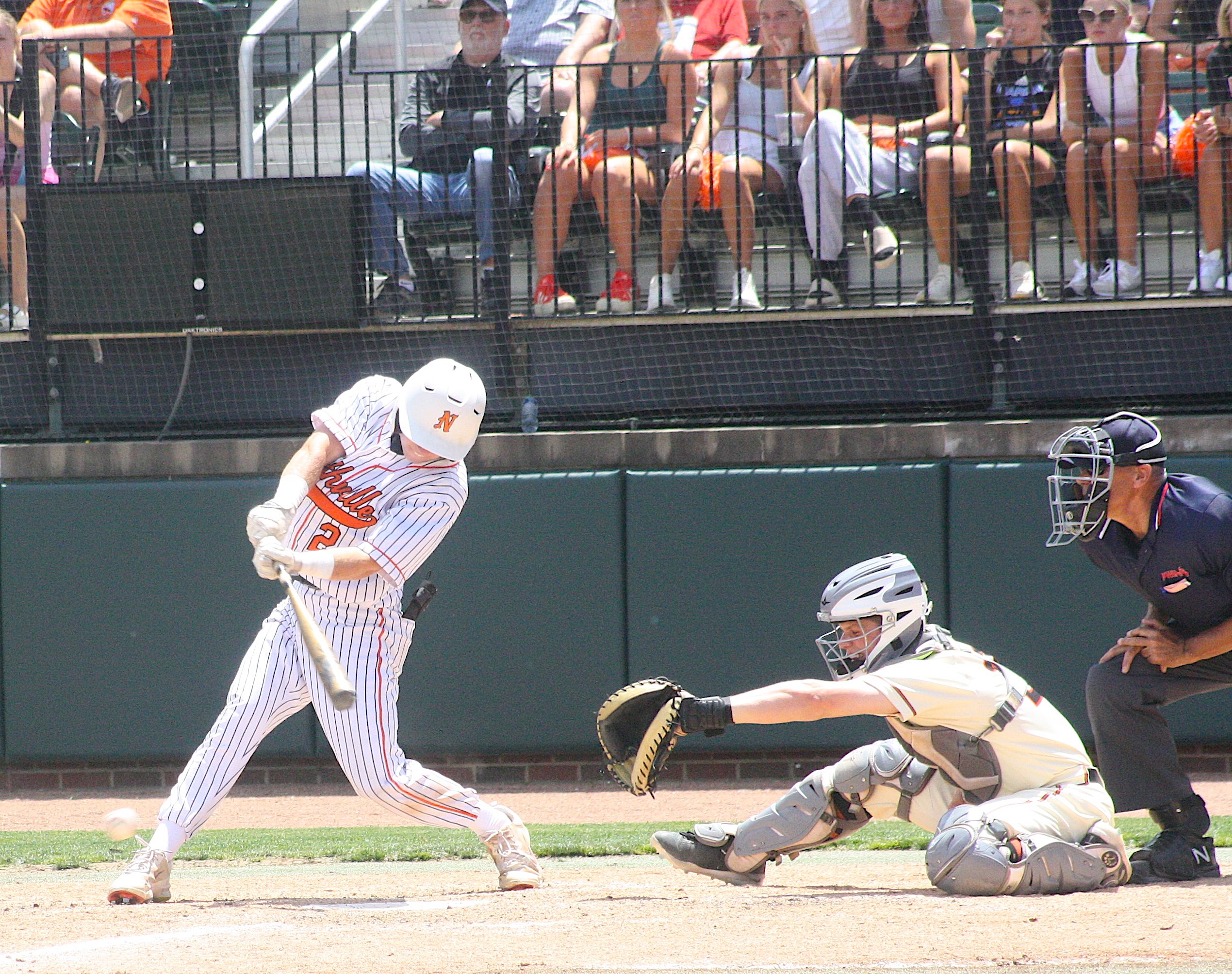 Carter Jurcisin hits a hard ground ball during the D1 title game