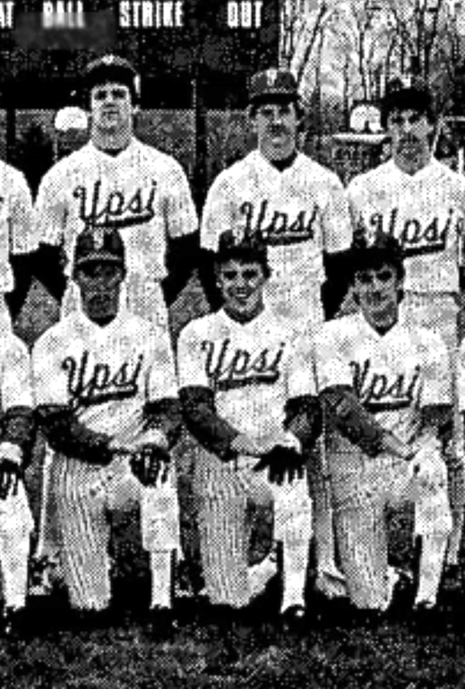 Brian Dieringer kneeling in the middle of first row while posing for the 1986 Ypsilanti High baseball team