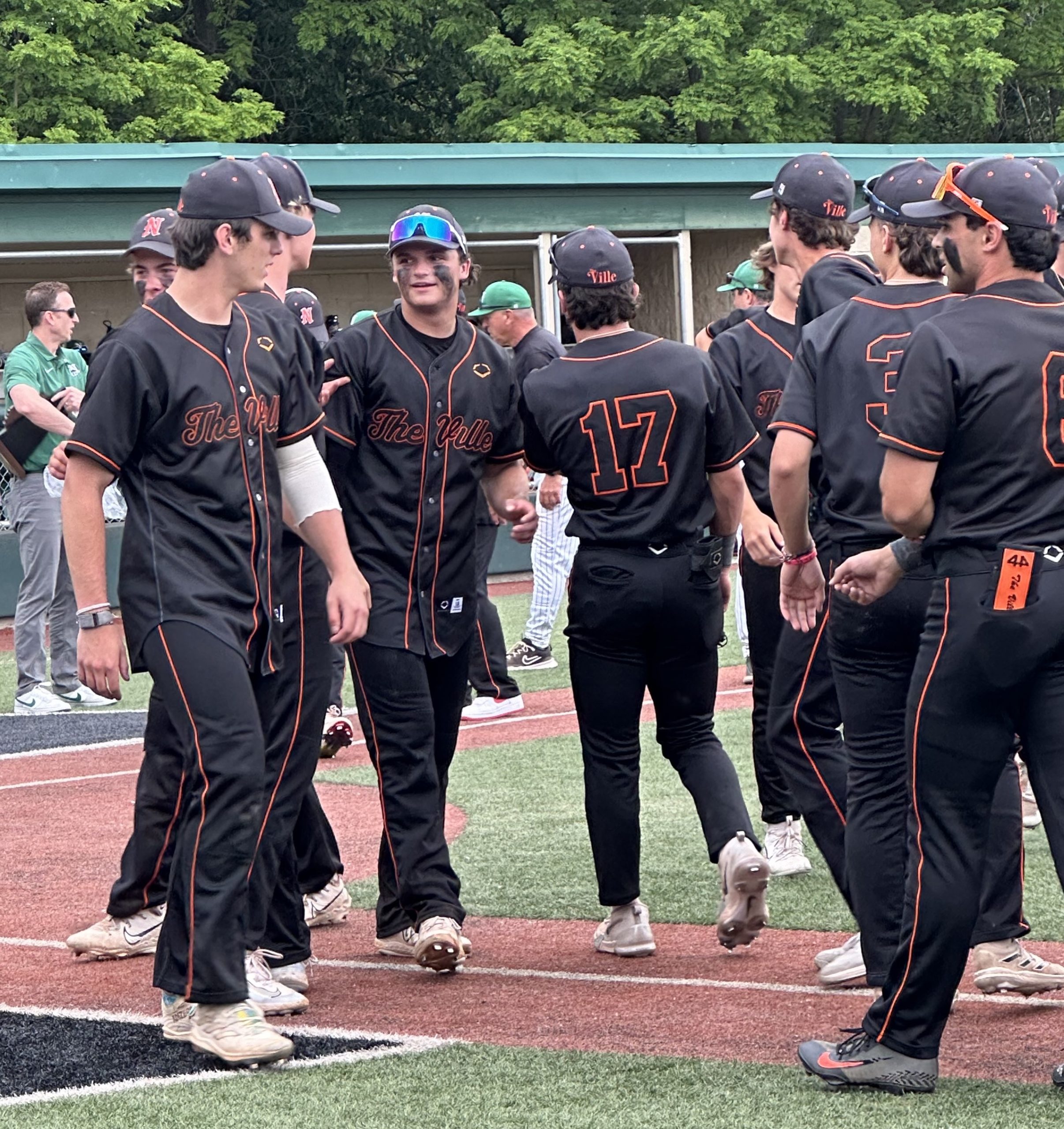 NVdistChamps2 - Social House News Evan Deak is congratulated by teammates following a sterling pitching performance