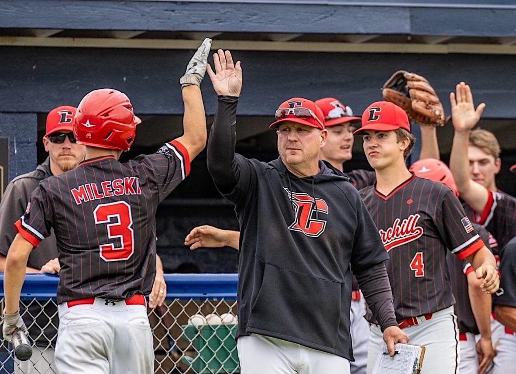 Livonia Churchill Head Coach Lawrence Scheffer and his gritty baseball team advanced to the MHSAA D1 regional final Thursday with a thrilling victory over Monroe. PHOTO COURTESY OF VASILNEK IMAGES