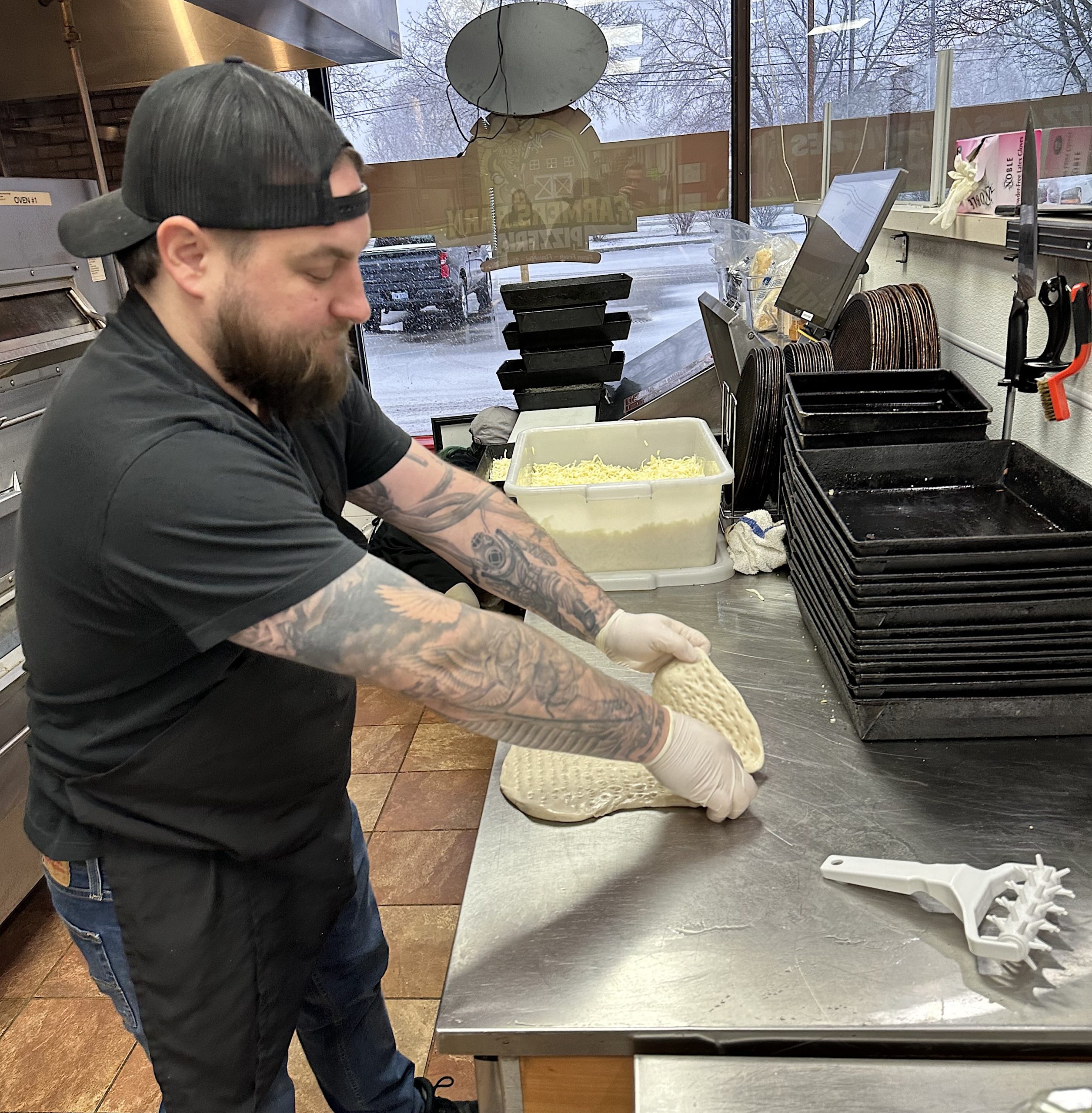 FarmBarn2 - Social House News Farmers Barn master pizza maker Derrick Favot prepares a crust at the Plymouth location