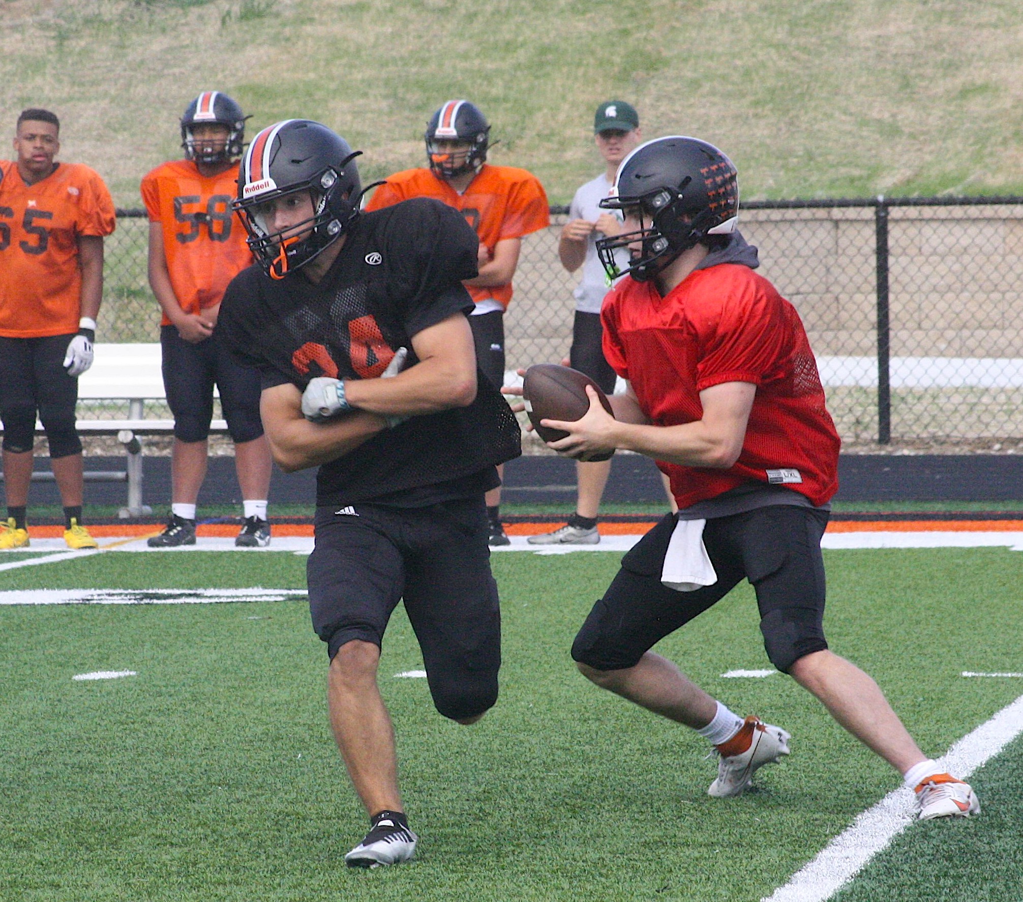 A Northville quarterback gets ready to take off on a keeper during a recent practice