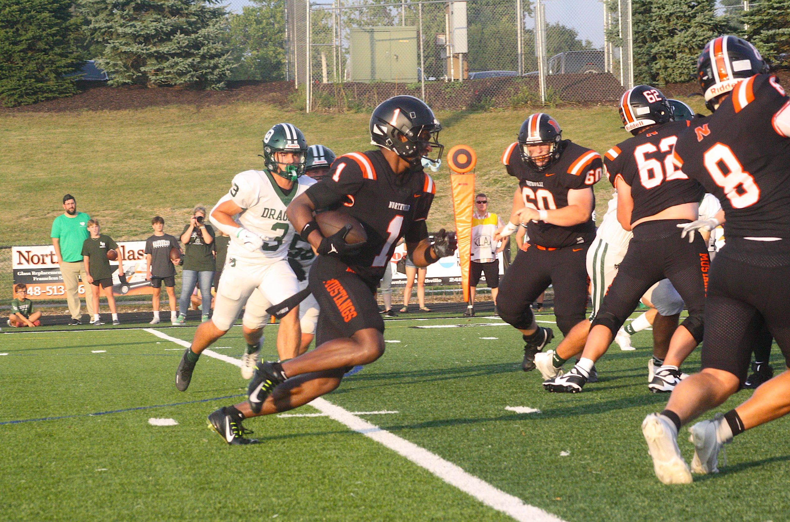 Colin Charles carries the ball against Lake Orion
