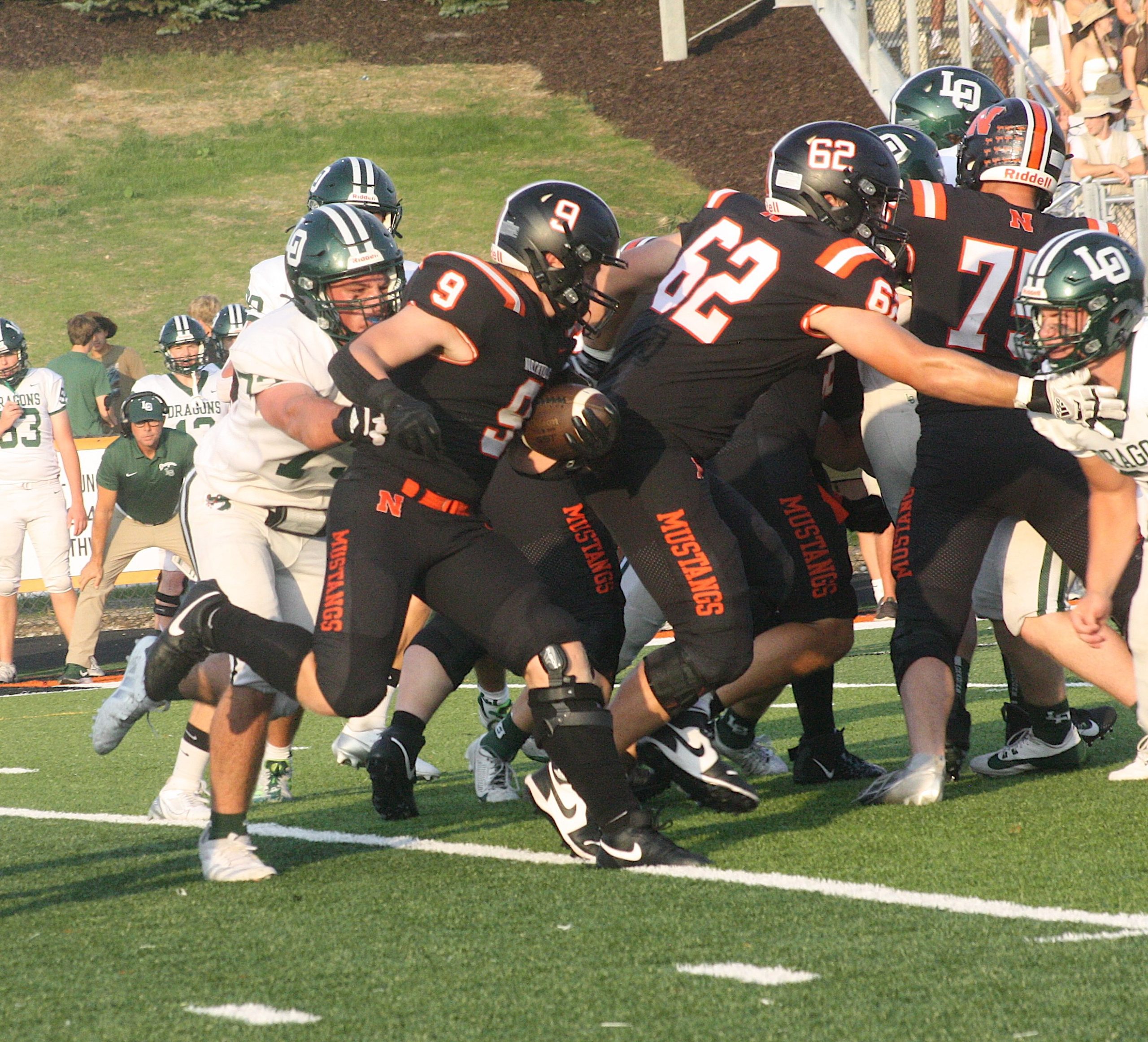 Max DeFore carries the ball against Lake Orion in Week 1