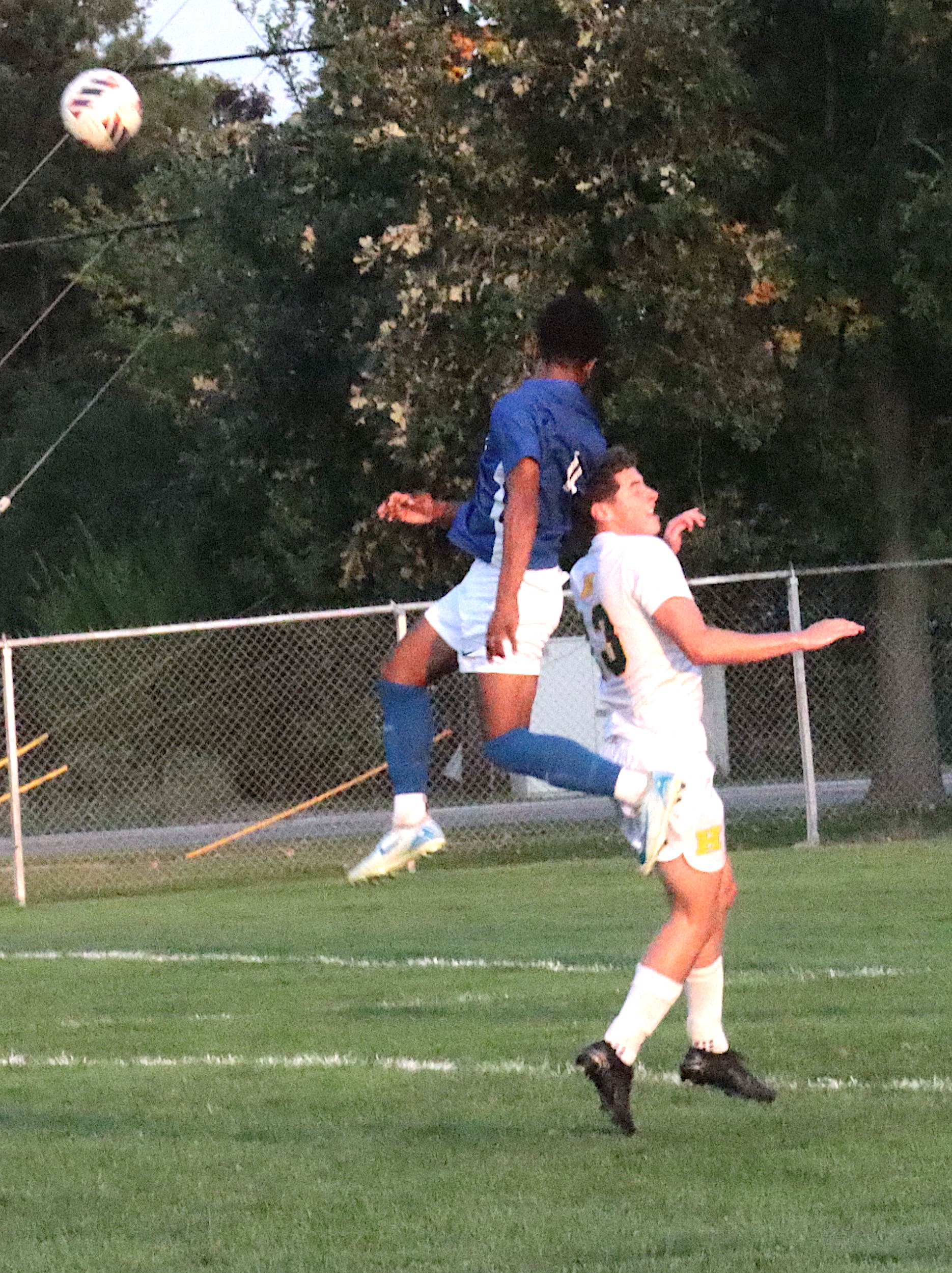 Bryan Baker elevates for a header