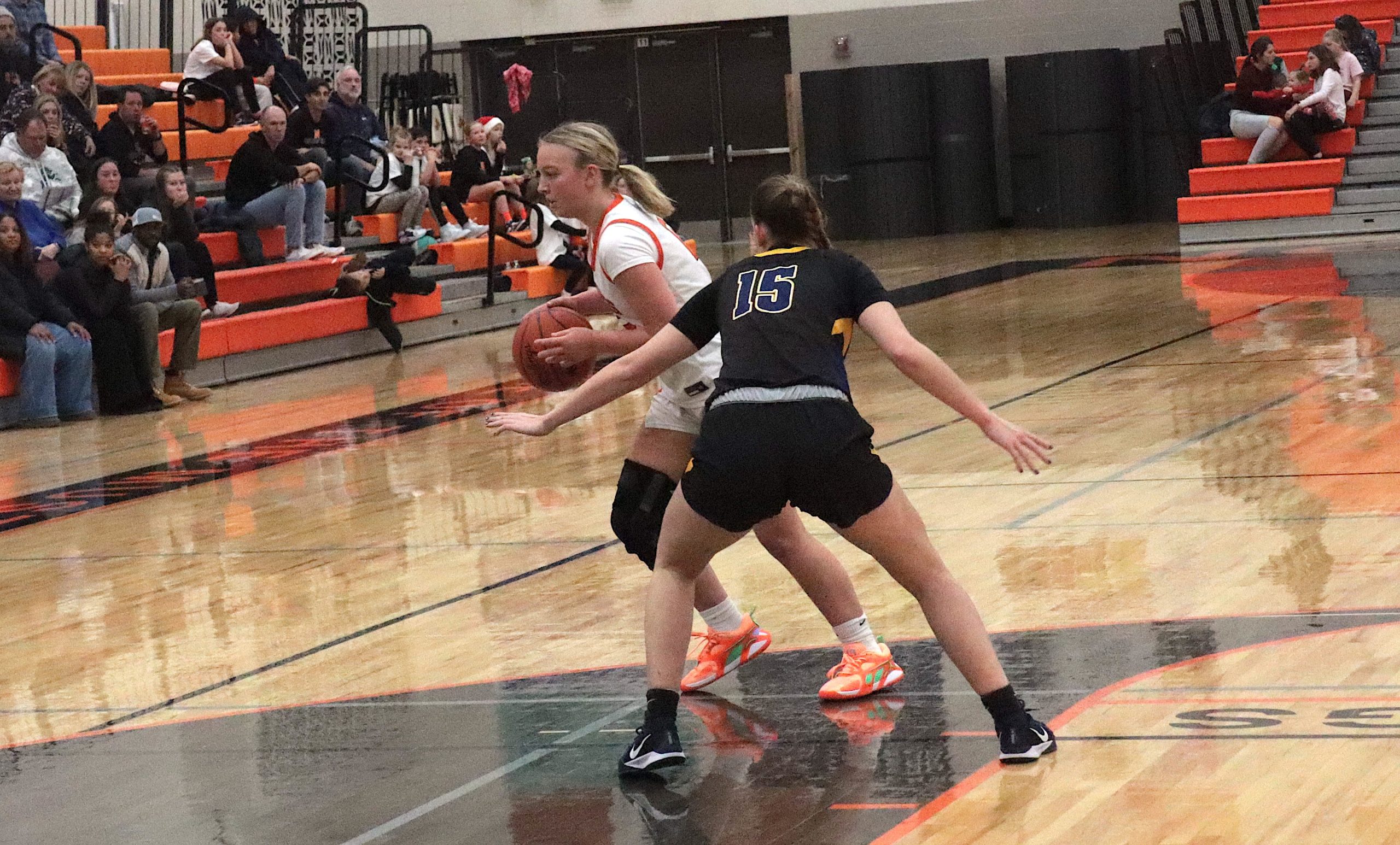 Wolves5 - Social House News Senior Lyza Koski dribbles around a Clarkston defender