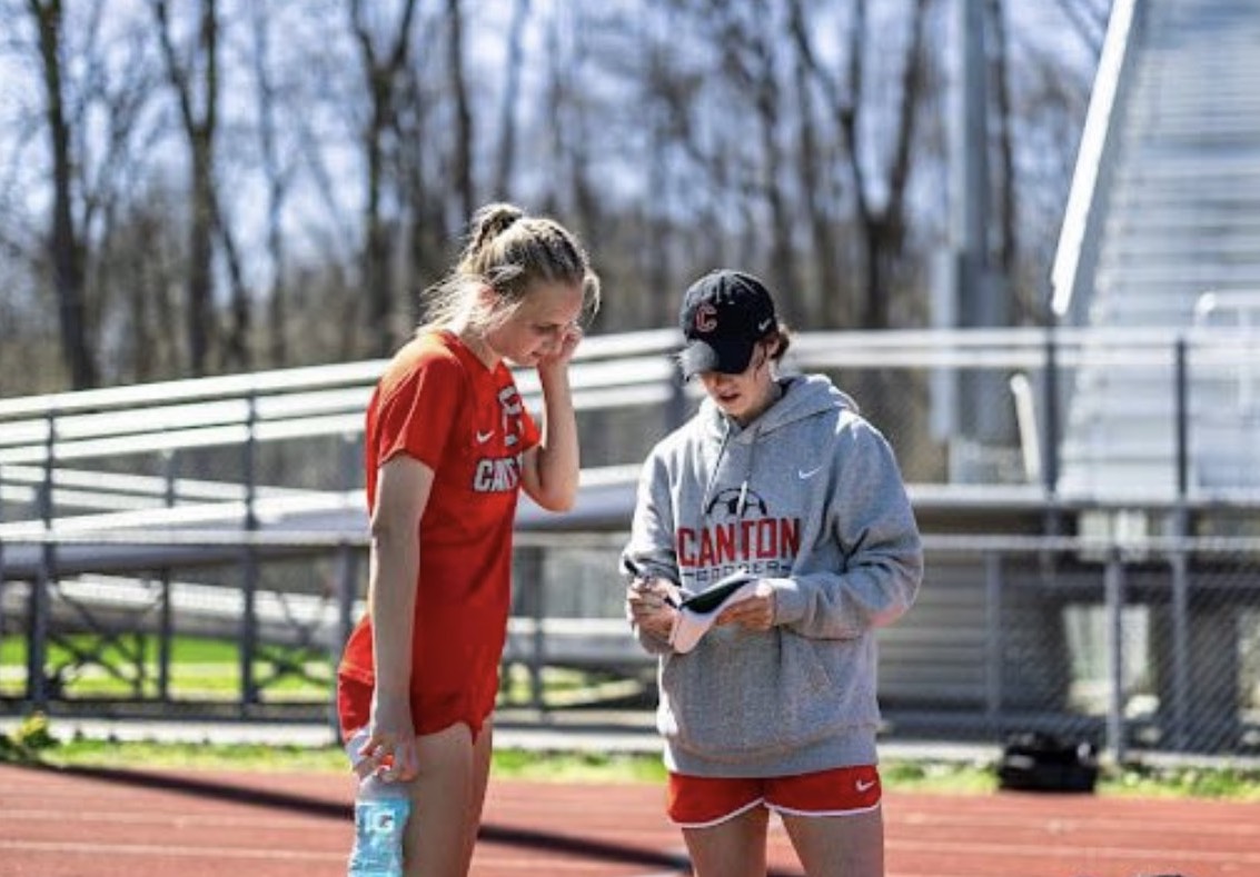 Annette Baker is pictured talking strategy with a Canton player last season PHOTO BY COOPER SCHWARTZ