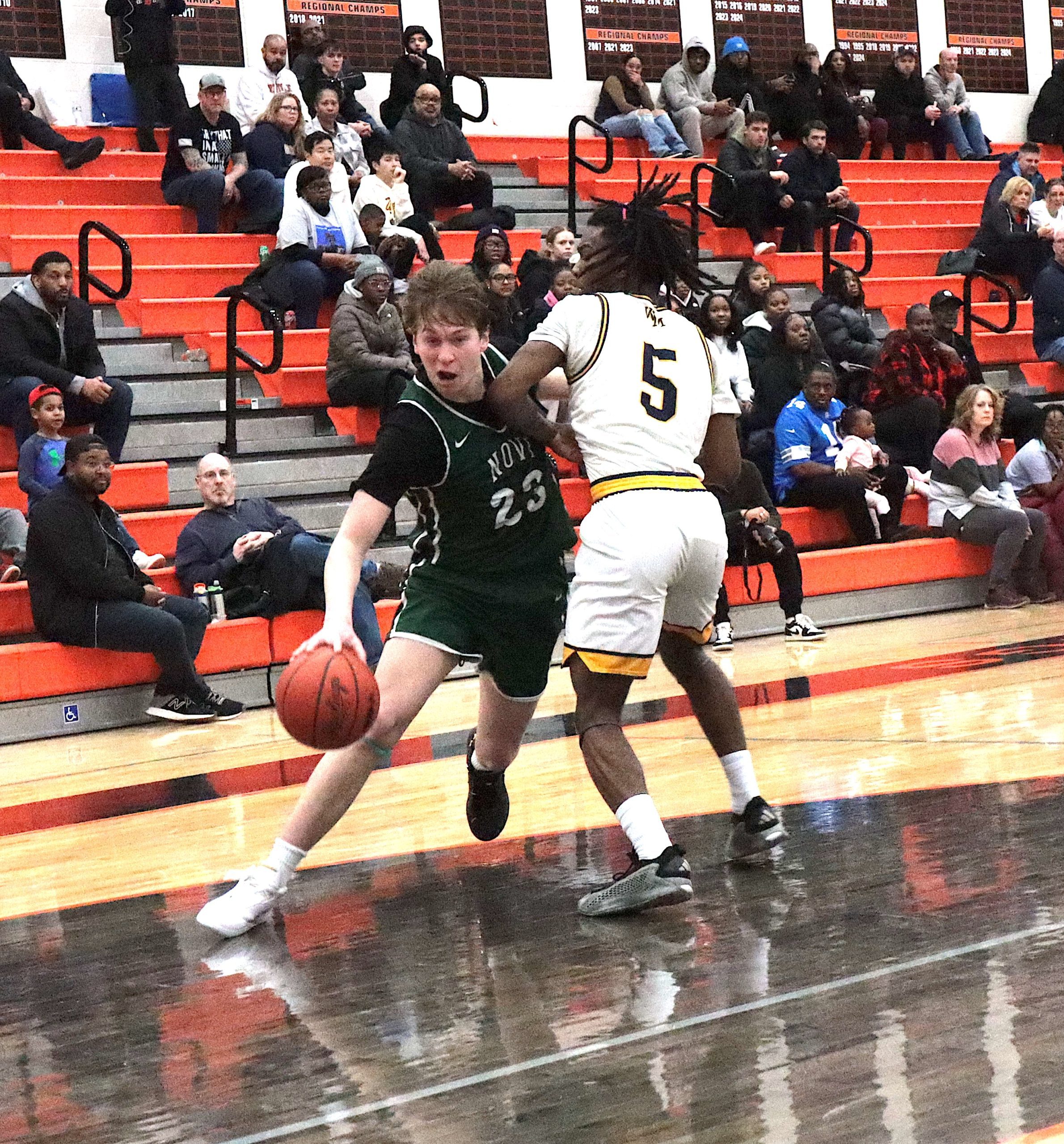 GreenDay3 - Social House News Chase LeFevre drives against Jaylohn Allen