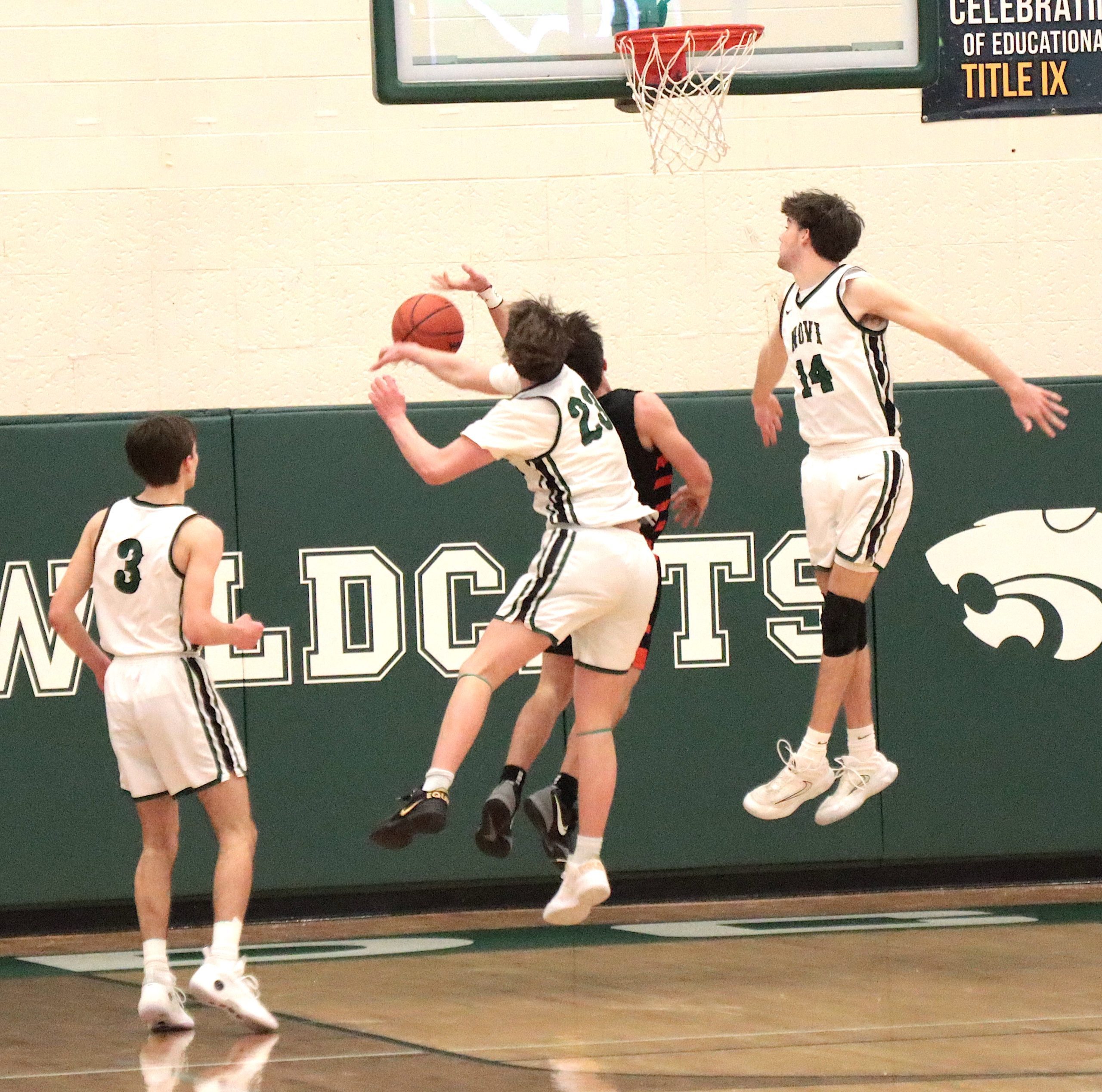 nnthriller1 - Social House News A pair of Novi players deny Northville on a fastbreak