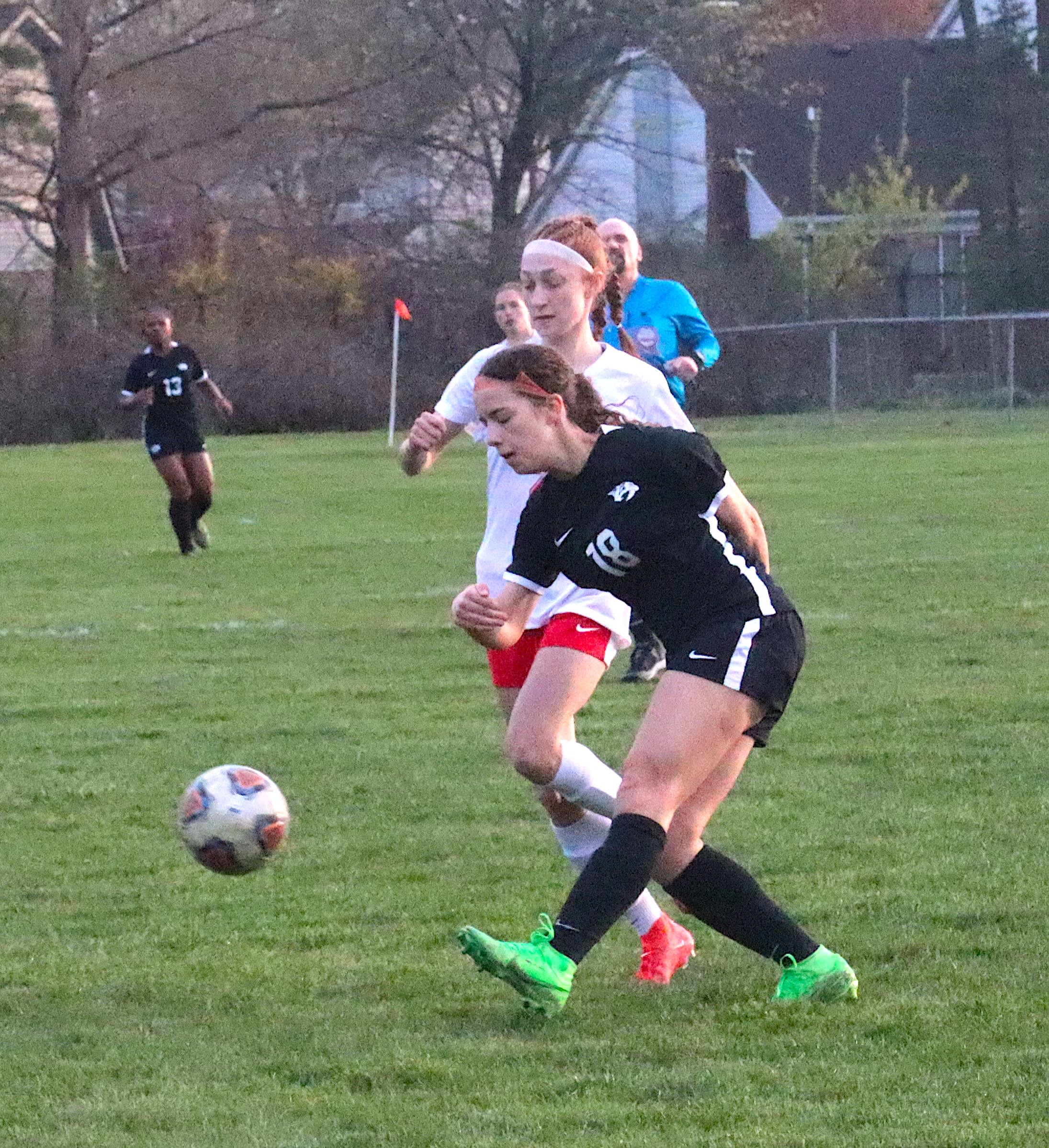 Among the returning Canton players Annette Baker has coached for multiple years is current senior Ava Murphy who is pictured defending a Plymouth player during a 2024 match