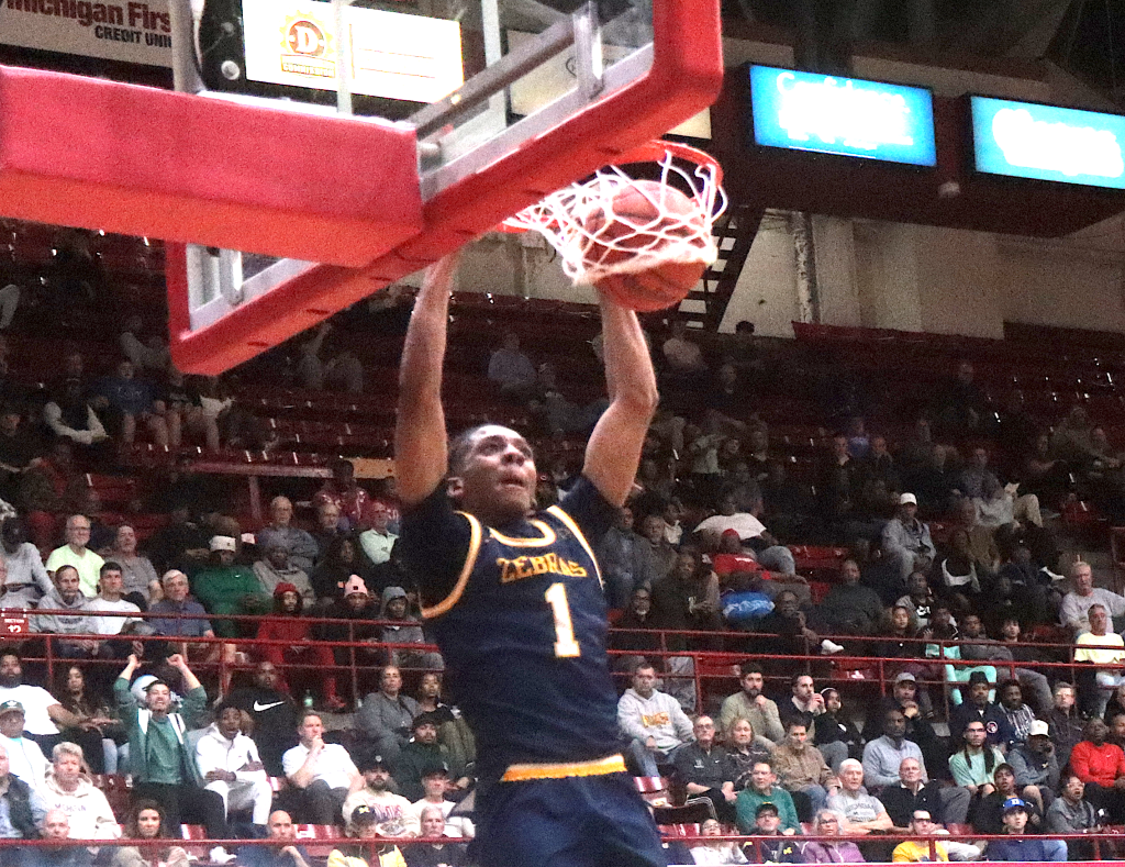 Austin Tori slams the ball through the hoop Tuesday against King.