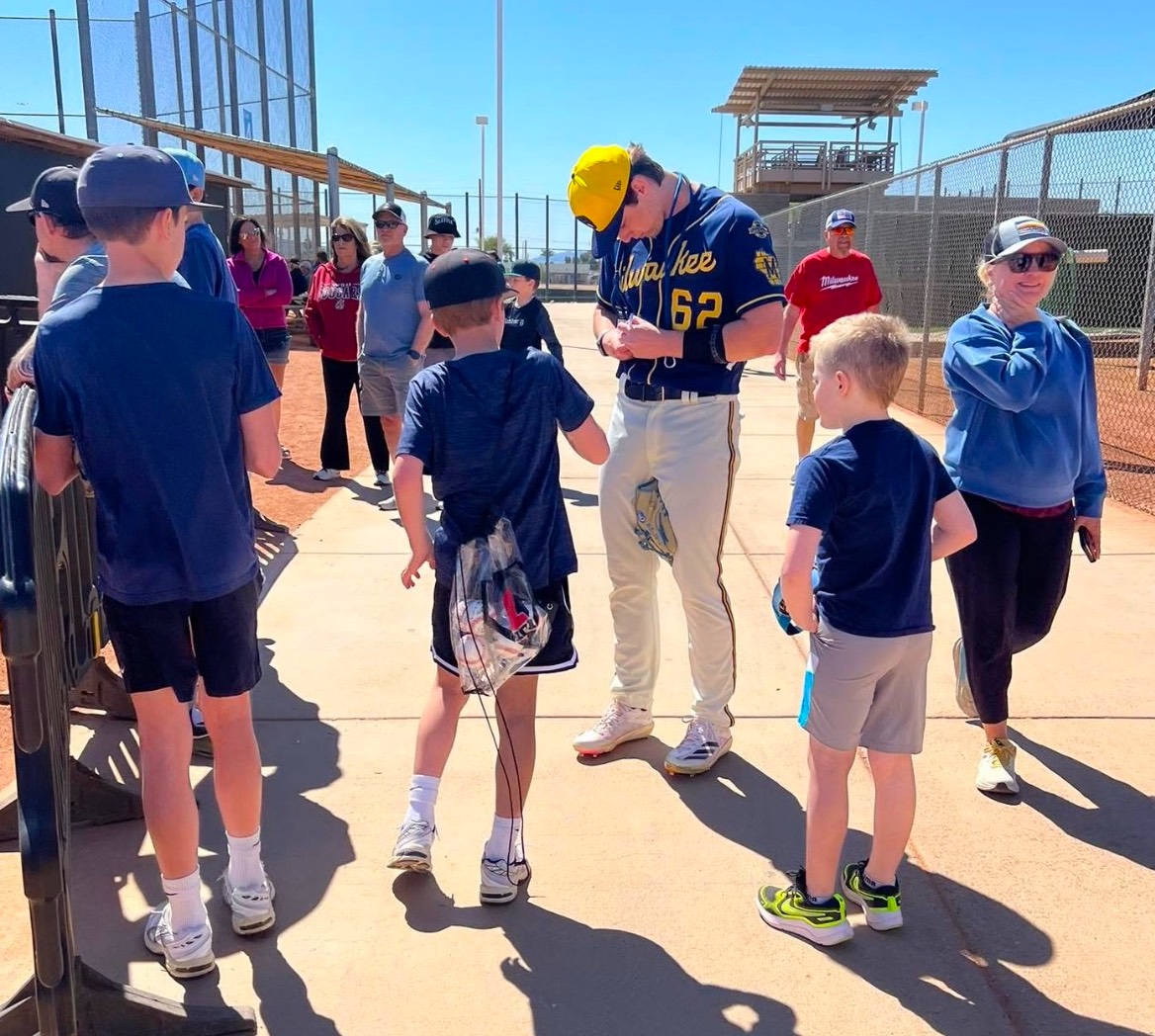 Joey3 - Social House News Joey Broughton signs autographs for young fans at the Brewers spring training facility