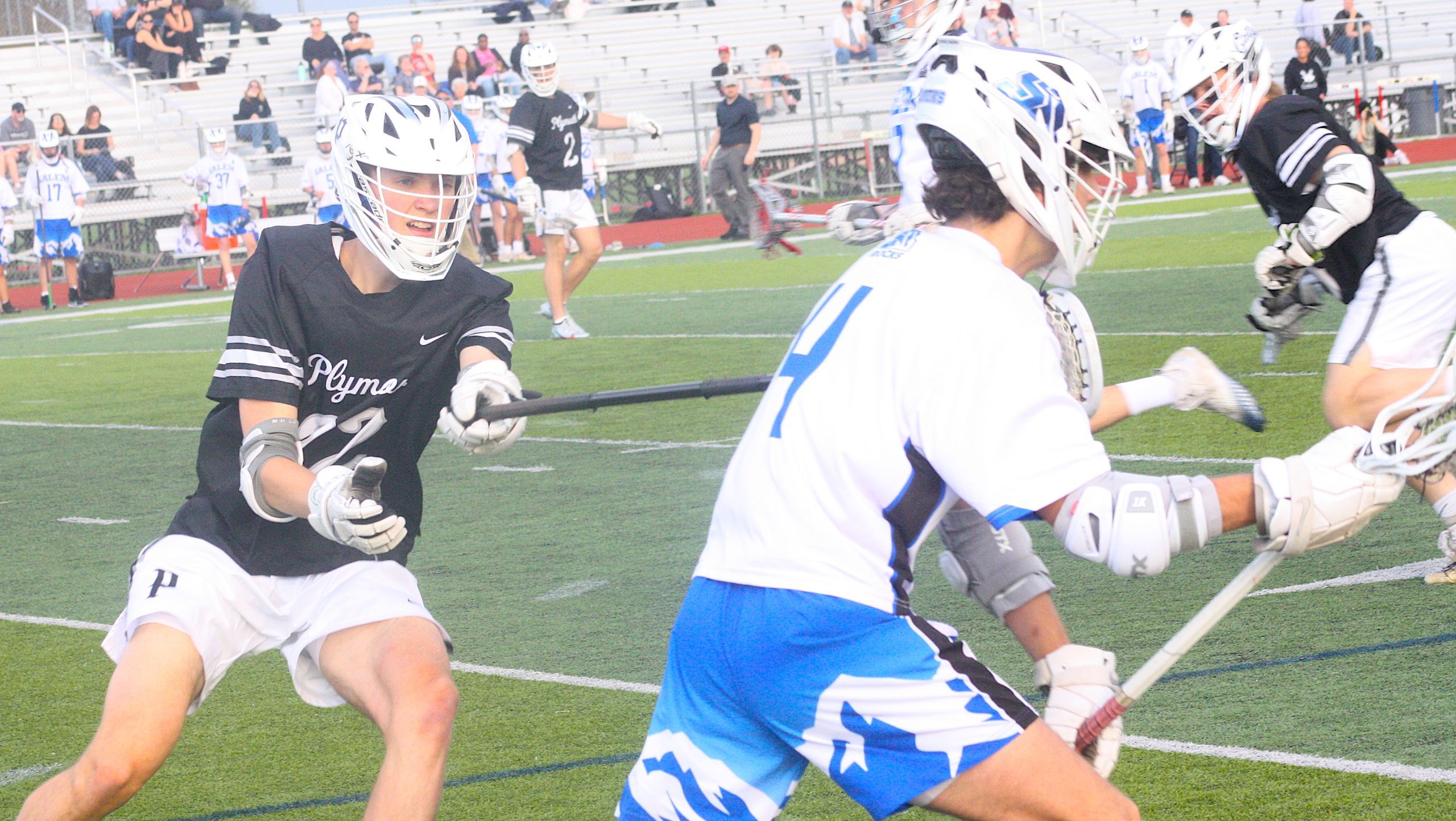 Plymouth's Brady Peregord shadows Salem's Sam Libbing during the first quarter of Wednesday's game.