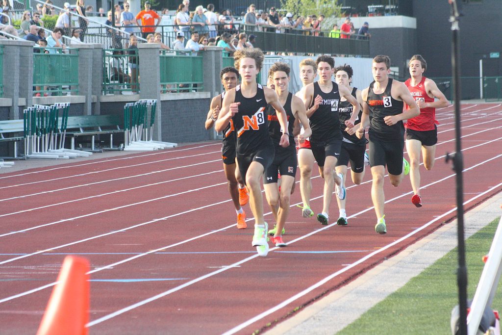 A Northville runner leads the field in the hotly-contested 1,600-meter run during Friday's MHSAA D1 regional event at Novi High School.