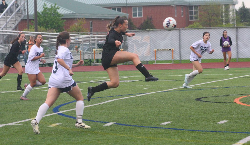 Senior Daniela Recio Romero advances the ball during Tuesday night's Senior Night victory over Livonia Stevenson.