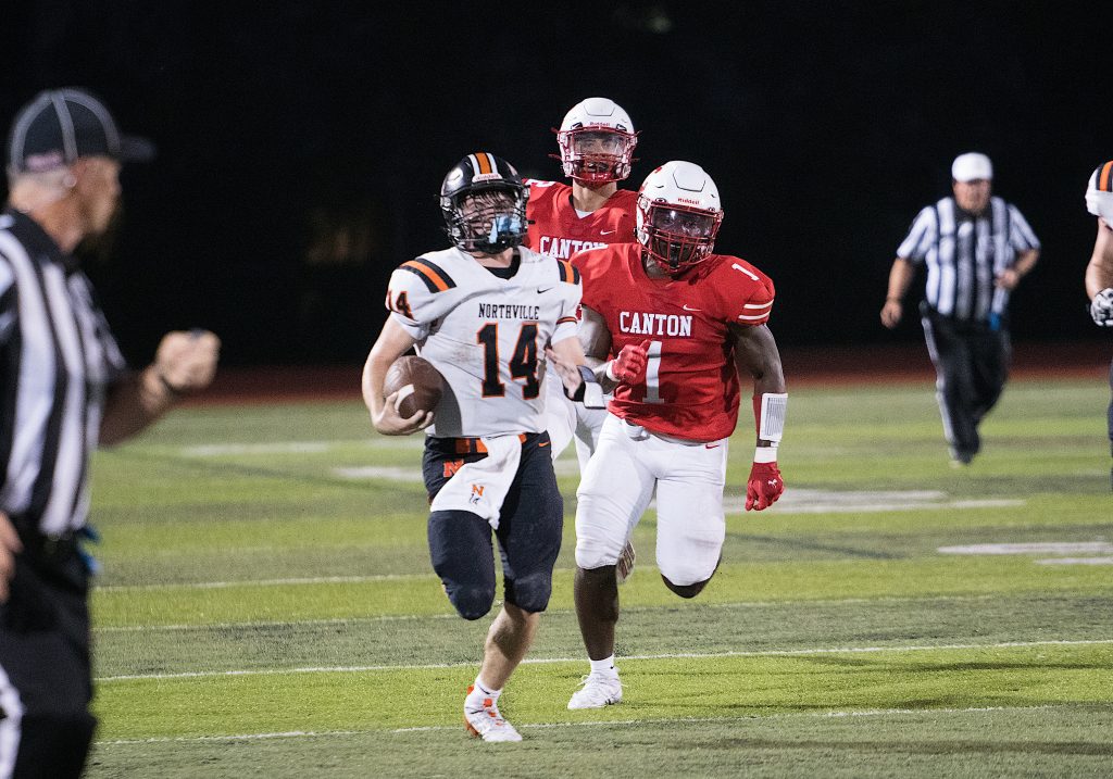 Northville senior quarterback Cooper Derkach breaks a long run against Canton last season. PHOTO BY NOEL RANKA