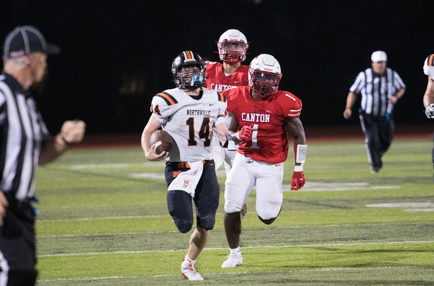 Northville senior quarterback Cooper Derkach breaks a long run against Canton last season. PHOTO BY NOEL RANKA