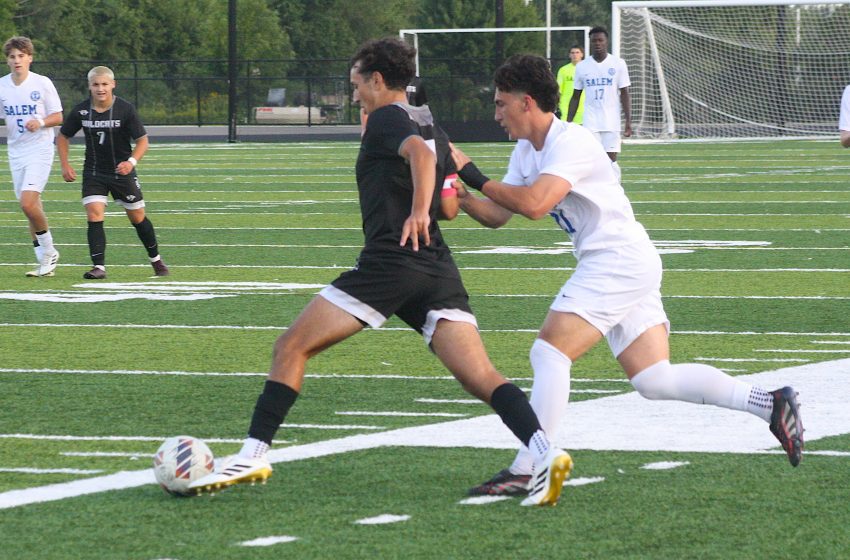 Salem's Chase Lieb shadows Plymouth's Mariano Serapiglia during Thursday night's match on the P-CEP North field.