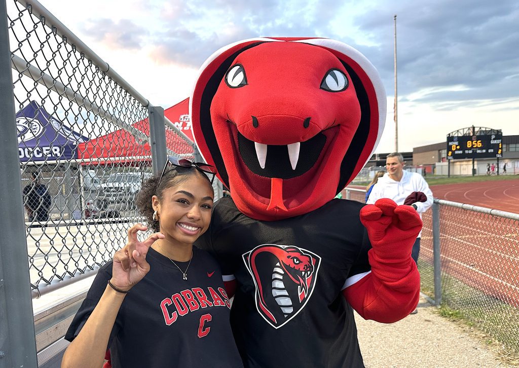 Canton's new cobra mascot is pictured with Canton senior McKenzy Wilson, a member of the school's student council.