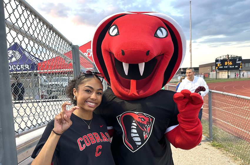 Canton's new cobra mascot is pictured with Canton senior McKenzy Wilson, a member of the school's student council.