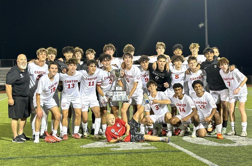 Members of Canton's boys soccer program pose with the P-CEP championship trophy they won Thursday with a 2-1 victory over Salem.