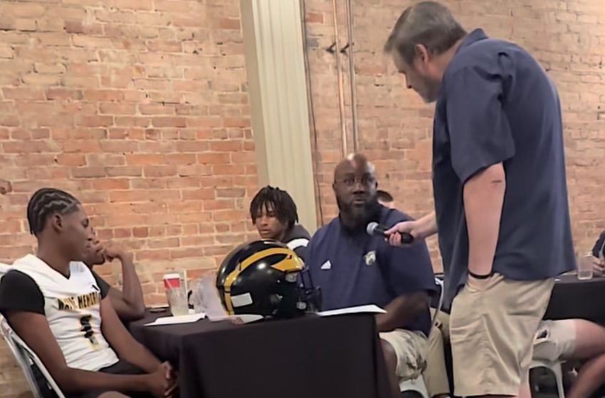 Wayne Memorial Head Football Coach Eric Pettway is interviewed by Sean Baligian during the 2025 KLAA Football Media Day at Genitti's Hole In the Wall in Northville.