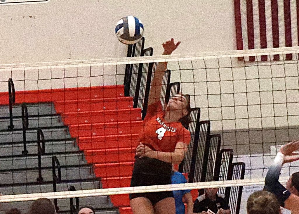 Northville senior Kaylyn Tuck elevates for a kill against Salem.