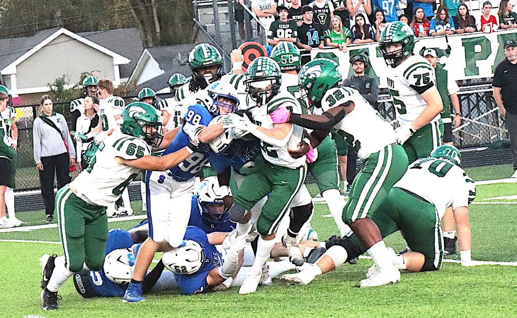 Novi running back Anthony Madafferi is stuffed for no gain by the Salem front seven.
