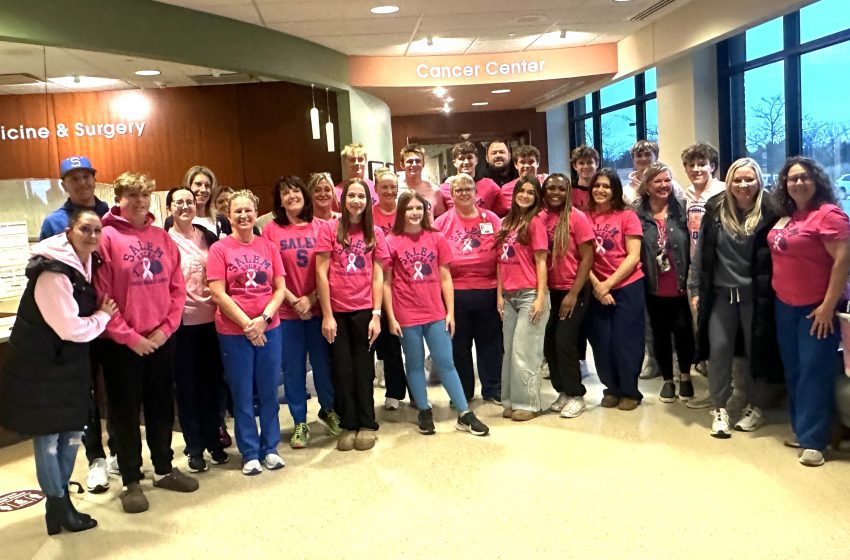 Salem football, pom and cheer members pictured are Kristina Candito, Ryan Groh, Laurel Gulyas, Molly Scully, Bella Papazoglou, Elle Garrett, Hannah Gad, Betsy Burger, Allison Schafer, Greg Ladley, Luke Locke, Gabe Burger, Kyle Candito, Salem Head Coach Landon Garrett, Landon Garrett, Jack Garrett, Coleton Ladley and Bryson Berry. Trinity Health Cancer Center nurses pictured are Jennifer Mann, Ranee Adams, Jenna Dunbar, Tammy Ross, Stacey Coppock, Sheri Bobby, Danielle K. and Lynn Ciebeskind.