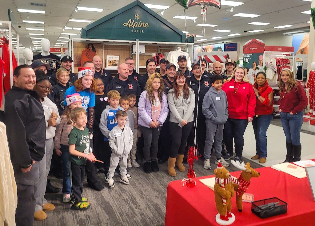 Pictured are volunteers and children who participated in Tuesday's Heroes & Helpers event.