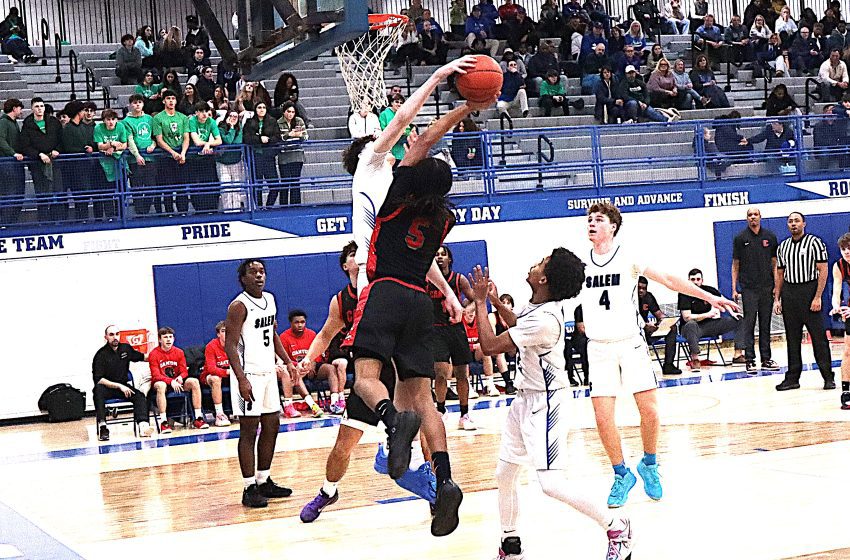 Salem's Mitch Paspal blocks a shot by Canton's Jaylen Tramble during Tuesday's 51-49 Rock victory.