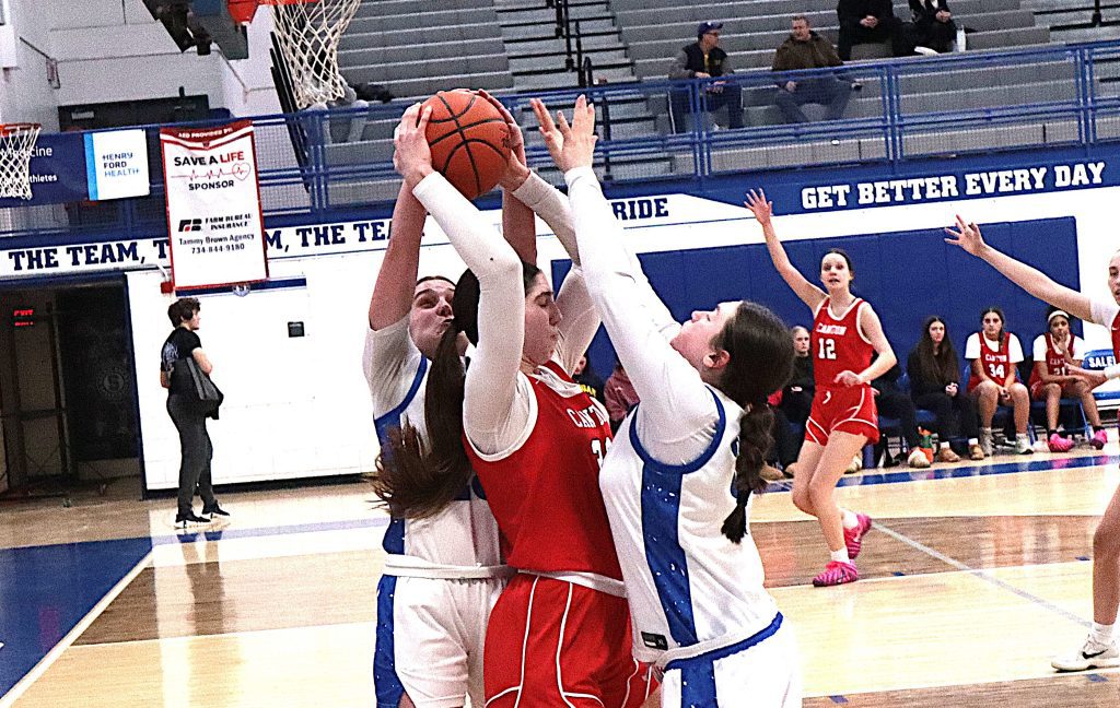 Salem's Julia Steinhebel (left) and Lainey Claramunt double team Canton star McKinsey Berlin during the second half of Tuesday night's game.