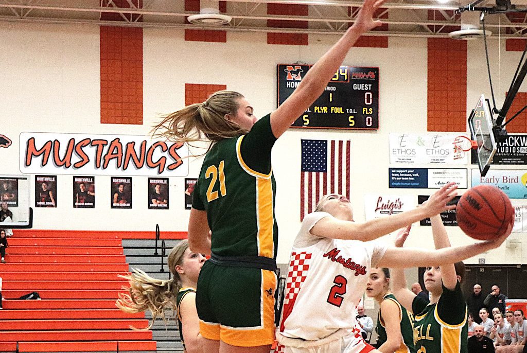 Howell's Lilly Williams registers one of her nine blocks during Friday night's 51-33 win over Northville.