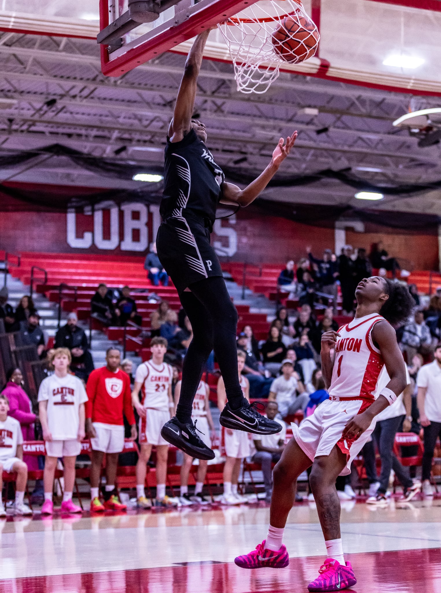 Plymouth senior Zerry Rue threw down an emphatic slam dunk in the first quarter PHOTO COURTESY OF VASILNEK IMAGES
