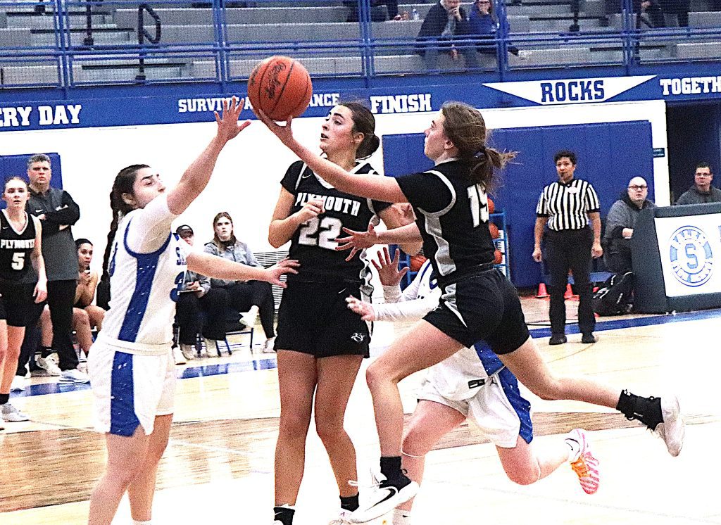 Plymouth senior Mackenzie Dicken executes a left-handed finger role Tuesday night against Salem.