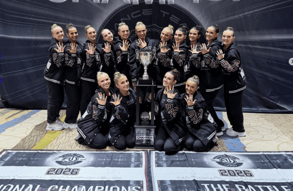 Members of the Plymouth-Canton Educational Park Dance Team display their National Championship rings after winning their third consecutive title this past weekend.