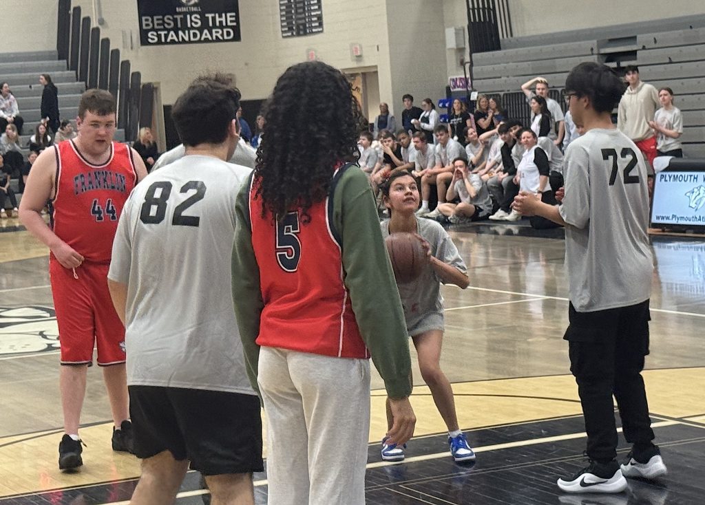 A member of the Plymouth-Canton Educational Park Unified basketball team fires up a shot Wednesday afternoon at Plymouth High School.