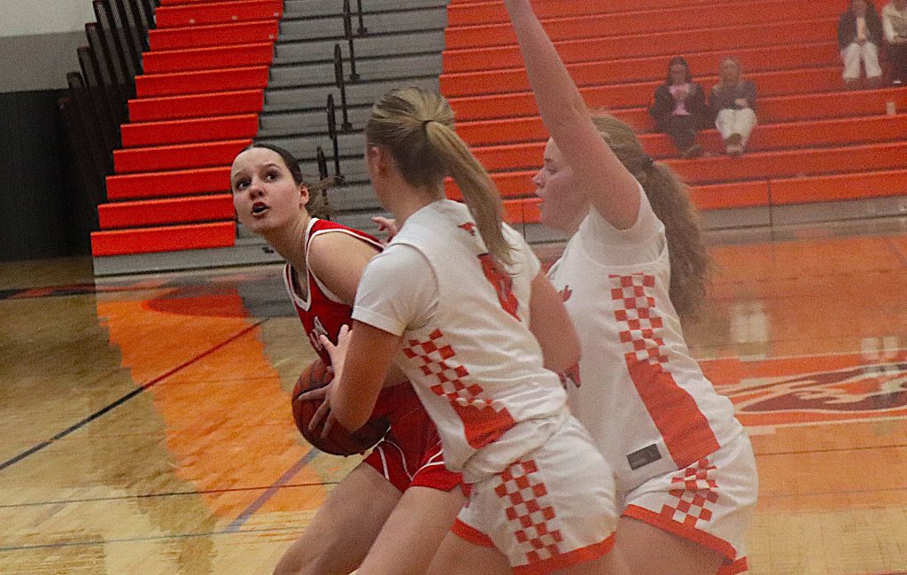 Northville's Ally Pace and Sophia Knapp double team Canton's Devyn Plozai.