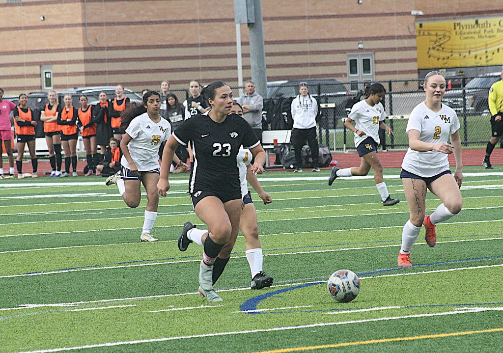 Plymouth's Abigail Kuehneman pushes the ball upfield Wednesday against Wayne Memorial.