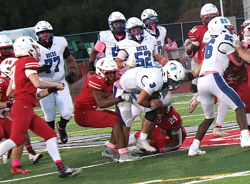 Canton senior Elliott Patten holds Salem QB Braylen Bowie to a short gain Friday night.